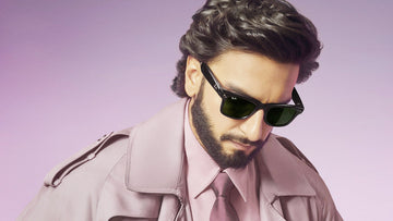 Ranveer Singh wearing black Ray-Ban sunglasses with a mauve suit