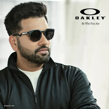 Black oakley sunglasses with a sleek, modern design and dark lenses.