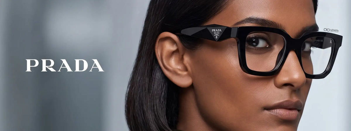 Black prada eyeglasses with a sleek, rectangular frame and the brand’s signature triangular logo on the temple.slider_item_ehbXhR