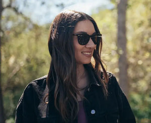 Black ray-ban sunglasses with dark lenses and a classic rectangular frame.