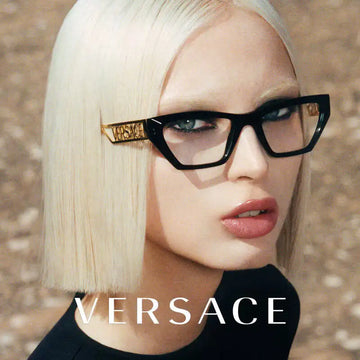 Black rectangular-framed glasses with gold-tone ’versace’ branding on the temples.