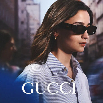 Black rectangular gucci sunglasses with gold-tone branding on the temple.
