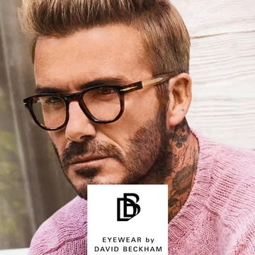 Black-rimmed rectangular eyeglasses with gold-tone temple tips, featuring a sleek and classic design.