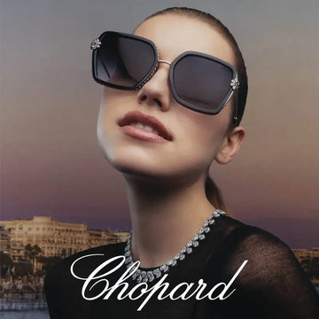 Black square-framed sunglasses with diamond embellishments on the temples and corners.